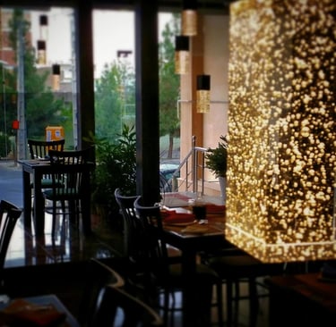 a restaurant with a large window and a table with chairs