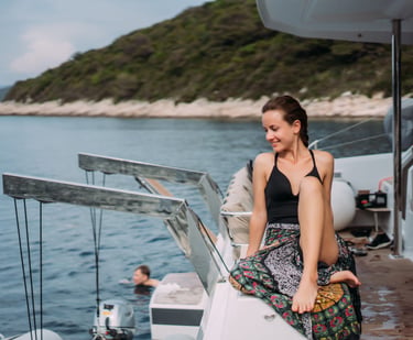 a sugar mommy sitting on a boat in the water