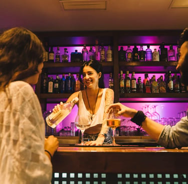 a sugar mommy is standing in front of a bar