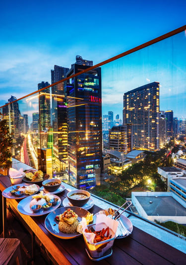 a table with plates of food and drinks in Sydney.