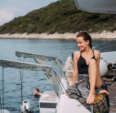 a sugar mommy sitting on a boat in the water