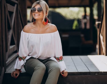 a sugar mommy in a white blouse and sunglasses